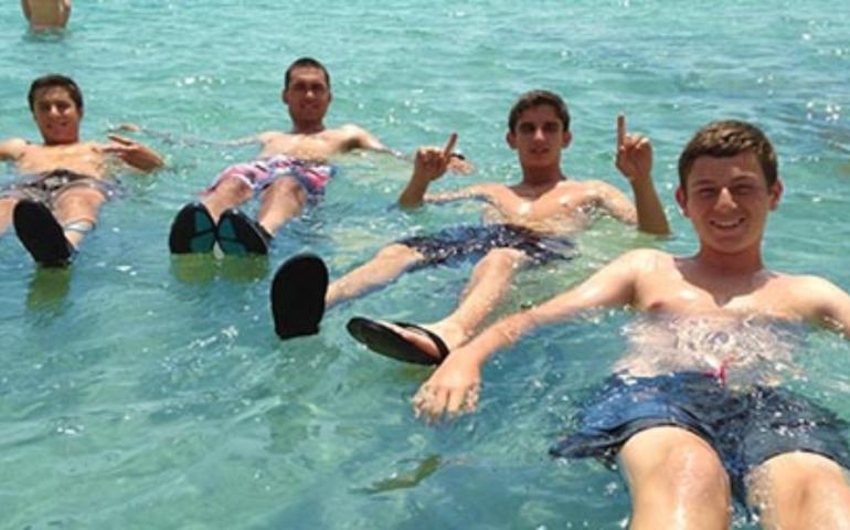 Teens floating in the Dead Sea