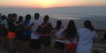Teens watching the sunrise at Masada